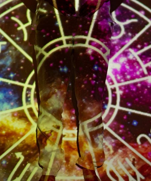 Woman in a light cardio pose feeling energetic and balanced in a modern space.